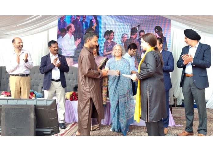 Union Textile Secretary Neelam Shami Rao distributing Modified Modern Steel Carpet Looms artisans in Srinagar. Union Textile Secretary Neelam Shami Rao distributing Modified Modern Steel Carpet Looms artisans in Srinagar.