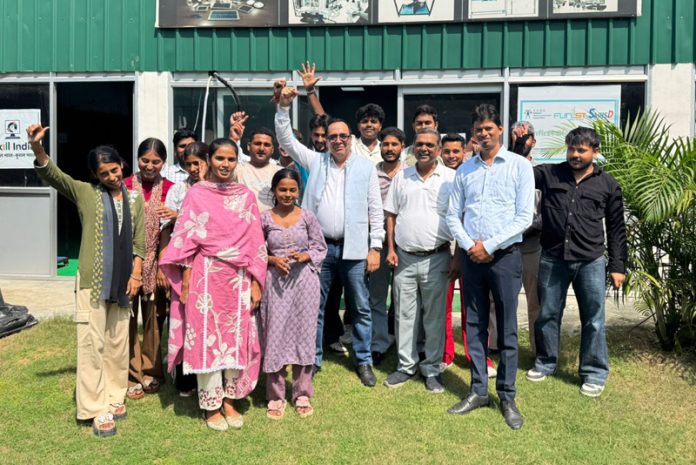 Jubilant J&K youth along with others at the launch of specialized skill development training in solar energy and EV charging technologies.