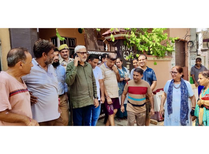 MLA Sham Lal Sharma conducting tour of flood-hit areas on Wednesday.