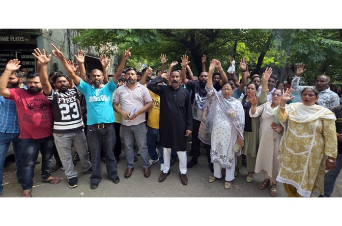 Members of JMC Workers Union raising slogans during a protest in Jammu on Friday. -Excelsior/Rakesh