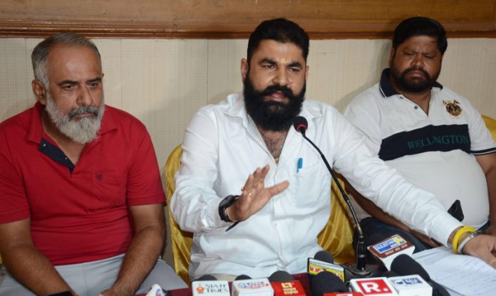 A mining contractor, flanked by others addressing press conference in Jammu on Tuesday. -Excelsior/Rakesh