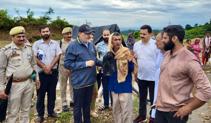 Sham Lal Sharma interacting with flood-hit families in Jammu North Constituency on Sunday.