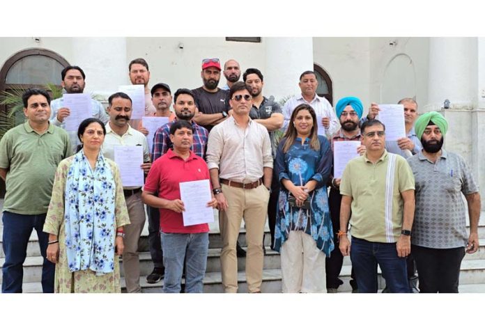 Joint Director Tourism Jammu, Aijaz Qaiser, issuing rafting permit to an operator in Jammu on Wednesday. -Excelsior/Rakesh