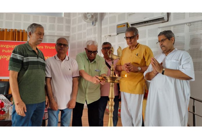 Dignitaries lighting the lamp at a function at Jammu on Thursday.