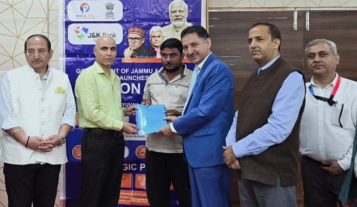 Dignitaries from J&K Bank sharing sanctioning letters with beneficiaries on Saturday. Dignitaries from J&K Bank sharing sanctioning letters with beneficiaries on Saturday.