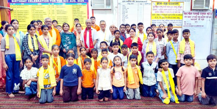 Pawan Kumar Shastri posing along with the students during a function in Jammu.