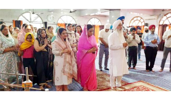Dr Ritu Singh along with others offering Ardaas during a function in Jammu.