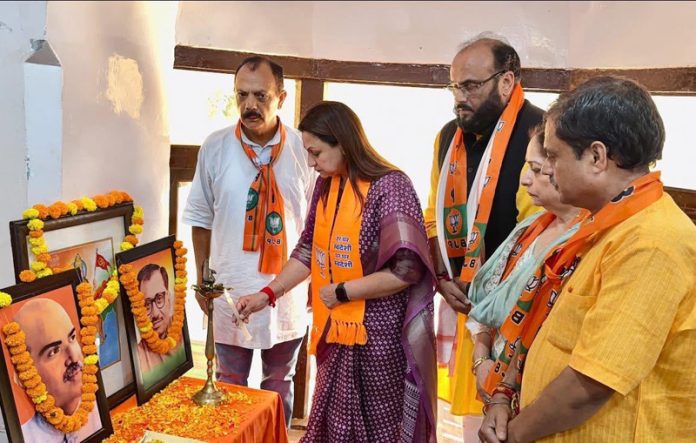 BJP leaders lighting a lamp during party function at Jammu on Sunday.