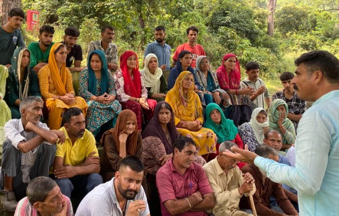 Pawan Khajuria addressing public meeting at village Jarmara in Udhampur on Sunday.