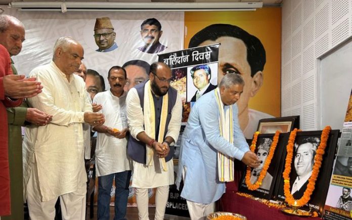 BJP leaders paying floral tribute to Tika Lal Taploo on his martyrdom day at Jammu on Saturday.