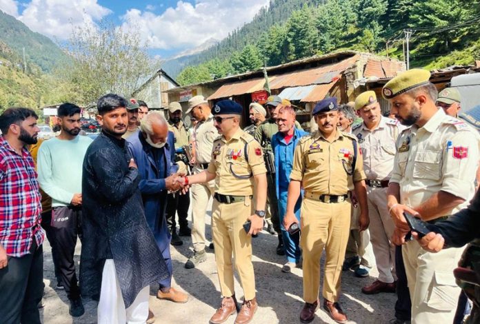 Additional SP Poonch Mohan Sharma meeting people in border area of Poonch on Sunday. Additional SP Poonch Mohan Sharma meeting people in border area of Poonch on Sunday.