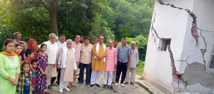 Former Minister Ajay Kumar Sadhotra assessing devastation caused after flash floods and land sinking at Kangar in Jammu.