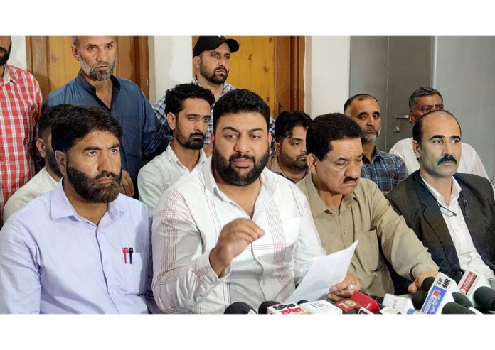 EJAC leader Sajjad Parray along with other members during a press conference in Srinagar on Saturday. -Excelsior/Shakeel EJAC leader Sajjad Parray along with other members during a press conference in Srinagar on Saturday. -Excelsior/Shakeel