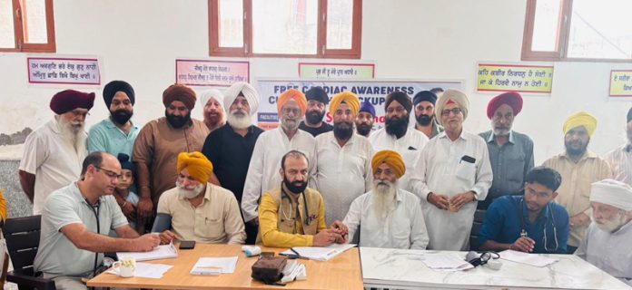 HoD Cardiology GMC &SSH Jammu Dr Sushil Sharma examining patient at Preet Nagar on Sunday.