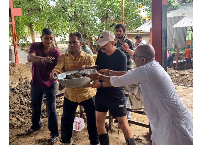 BJP activists led by MLA Jammu East Yudhvir Sethi doing social service at Jogi Gate Cremation Ground on Tuesday.