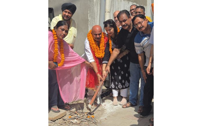 MLA Jammu East, Yudhvir Sethi kick starting lane and drain work at Rehari Chungi on Saturday.