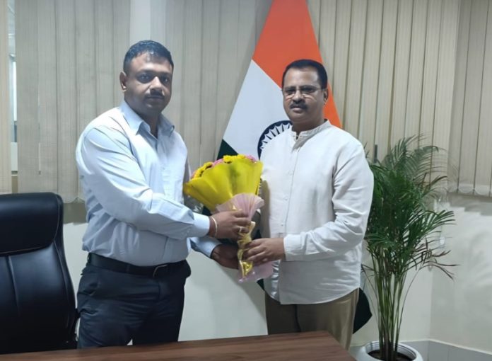 BJP vice president, Rakesh Mahajan during a meeting with Senior Divisional Commercial Manager of Railways at Jammu on Monday.