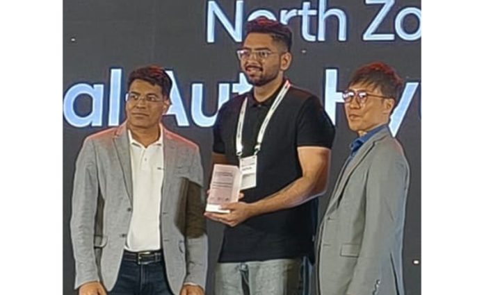 A representative of Fairdeal Auto Hyundai receiving an award on Tuesday.