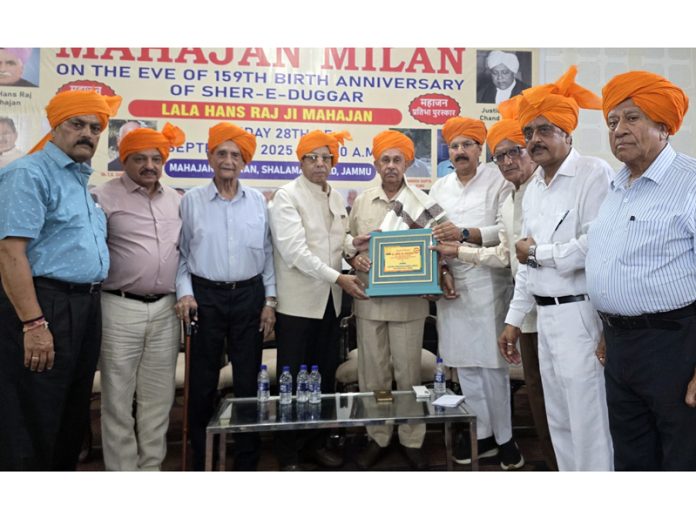 Mahajan Sabha felicitating prominent persons of the biradari during function on birth anniversary of Lala Hans Raj Mahajan on Sunday. -Excelsior/Rakesh