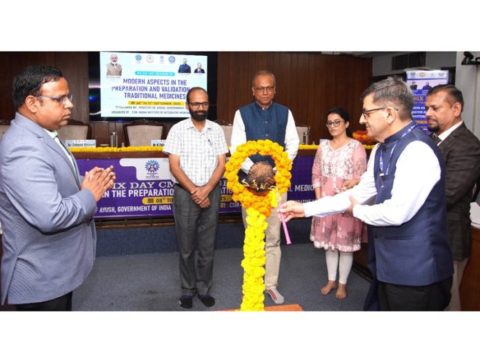Director CSIR-IIIM, Dr. Zabeer Ahmed along with others lighting the ceremonial lamp to inaugurate a CME programme for AYUSH Scientists/Teachers in Jammu on Monday.