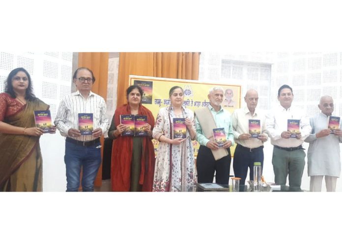 Dignitaries releasing literary collection of Dr Om Goswami during a function. Dignitaries releasing literary collection of Dr Om Goswami during a function.