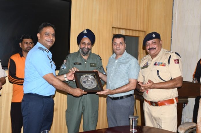 An Air Force officer receiving a souvenir from SDRF officers on completion of a disaster management course in Jammu on Saturday.