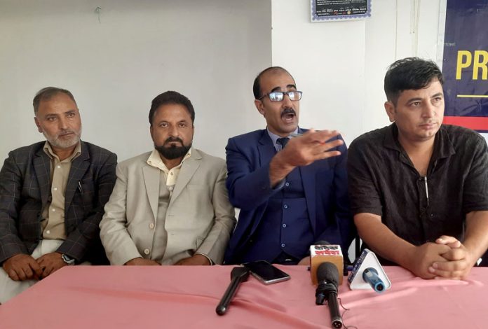 Leaders of J&K Teachers Forum addressing a press conference at Srinagar on Friday.