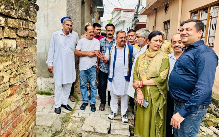 MLA Bahu, Ch Vikram Randhawa during visit to rain hit areas of Preet Nagar on Sunday.