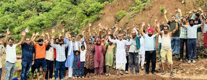 Senior political leader, Pawan Khajuria leading a protest at Majalta on Sunday.