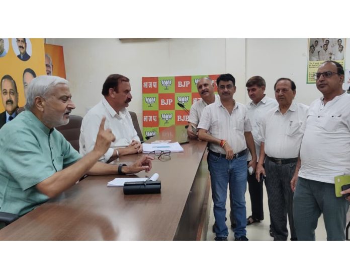 MLA Jammu North, Sham Lal Sharma listening people’s grievances at a public darbar at party headquarters at Jammu on Friday.