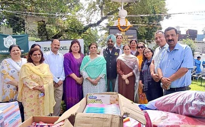 Dignitaries from Maharaja Hari Singh Foundation handing over flood relief to ADC Jammu Ansuya Jamwal on Thursday.