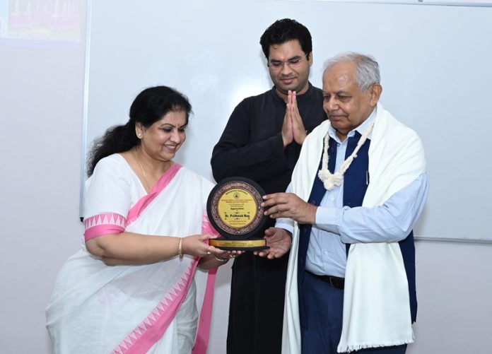 Dr Prithvish Nag presenting a memento to a participant during a conference on Wednesday. Dr Prithvish Nag presenting a memento to a participant during a conference on Wednesday.