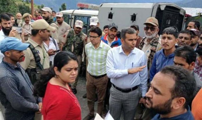 DC Ramban during visit to landslide hit Sana village on Thursday. DC Ramban during visit to landslide hit Sana village on Thursday.