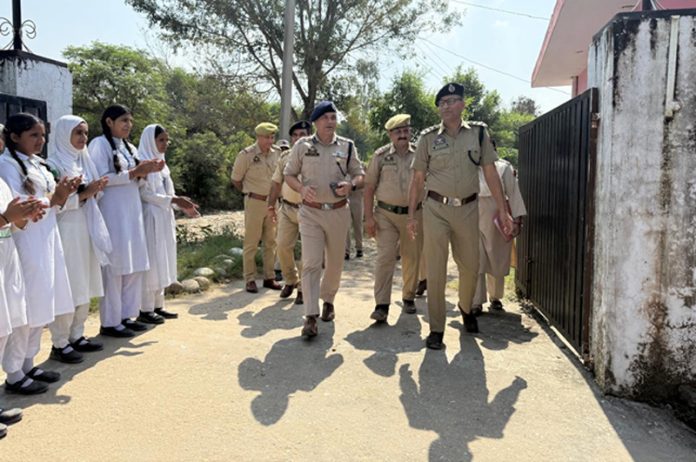 Police officers during visit to a school at Bajalta.