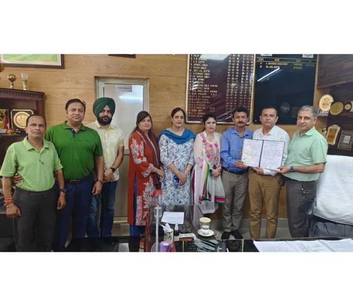 Director Agriculture displaying copy of revised NABL accreditation of Fertilizer Quality Control Lab.
