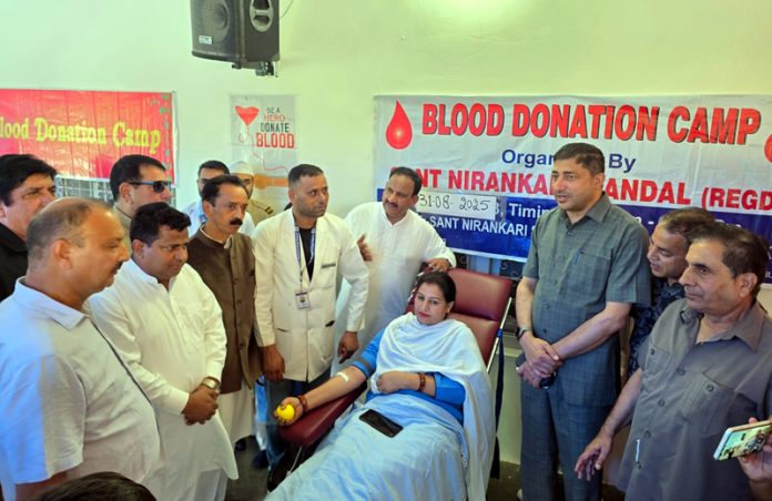 A donor donating blood during a camp by Sant Nirankari Mission in Rajouri.