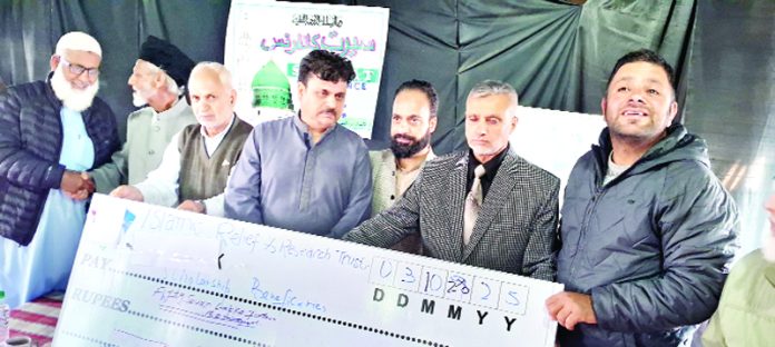 Members of IRRT donating Rs 65 lakh for the education of poor and orphan students in Srinagar.