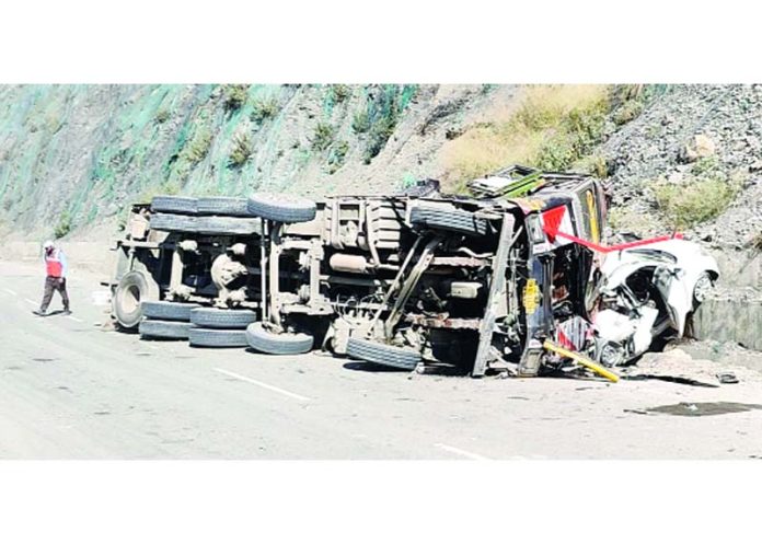 Remains of a truck and a car after accident in Ramban on Friday. -Excelsior/Parvez Mir