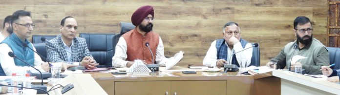 DDC Harvinder Singh chairing a meeting in DC Office Complex Doda.