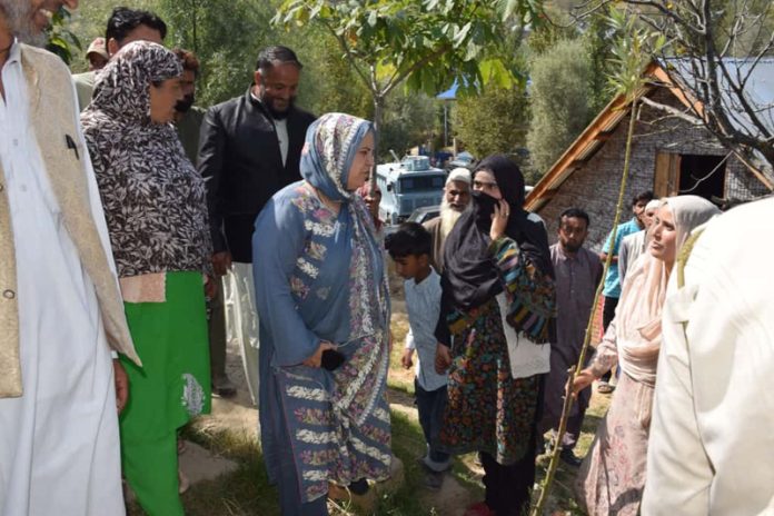 Minister Sakeena Itoo meeting fire afftected families in Kulgam on Thursday.