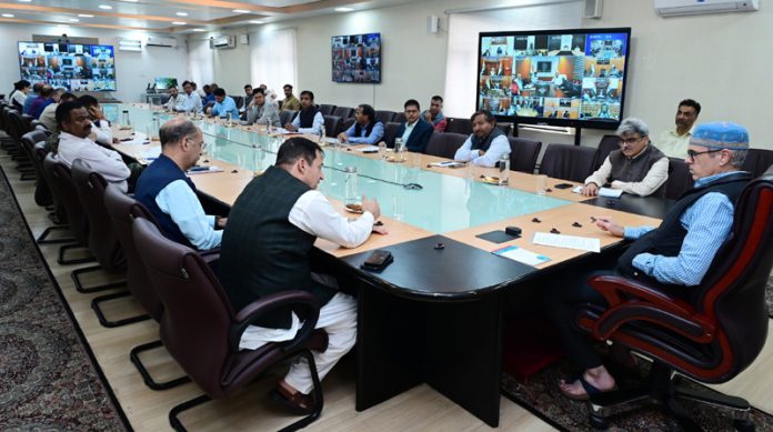 CM Omar Abdullah chairing a meeting in Srinagar on Friday.