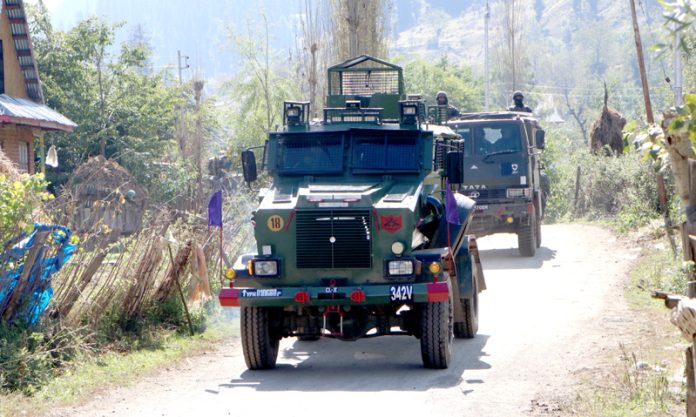 Security personnel carry out searches for the missing soldier in Anantnag on Thursday.