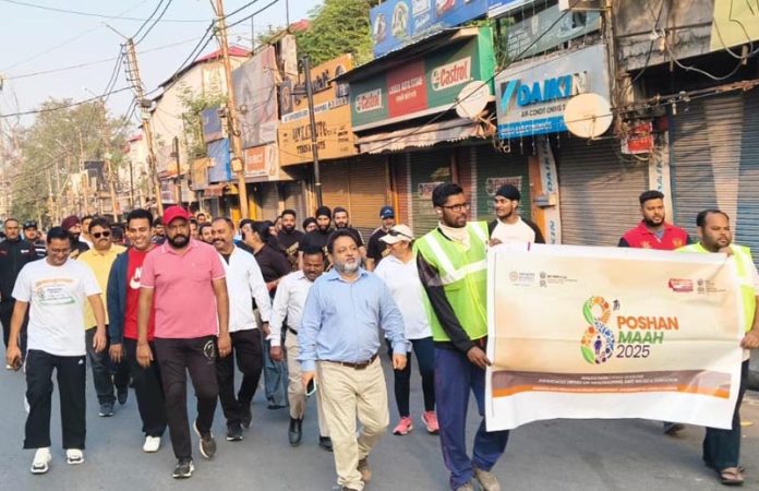 Participants of a walkathon organised by JMC moving on Jammu roads on Wednesday. Participants of a walkathon organised by JMC moving on Jammu roads on Wednesday.