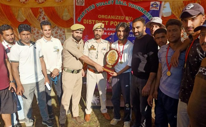 Police officers presenting trophy to winning team.