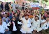 All J&K Daily Wagers Sangarsh Samiti members staging dharna near Press Club in Jammu. -Excelsior/Rakesh