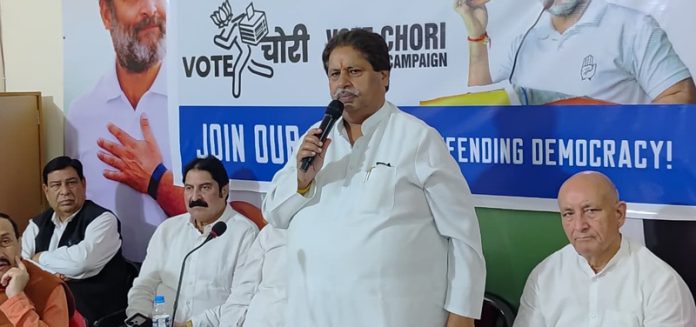 Cong working president Raman Bhalla addressing a party meeting in Jammu on Monday.
