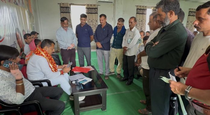 MLA R S Pathania during a grievance redressal camp in Udhampur.