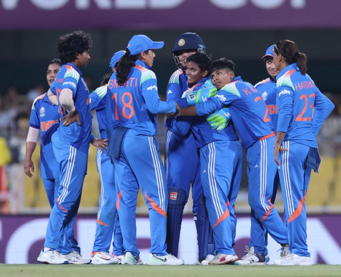 Team India celebrating after beating Sri Lanka in World Cup opener at Guwhati.