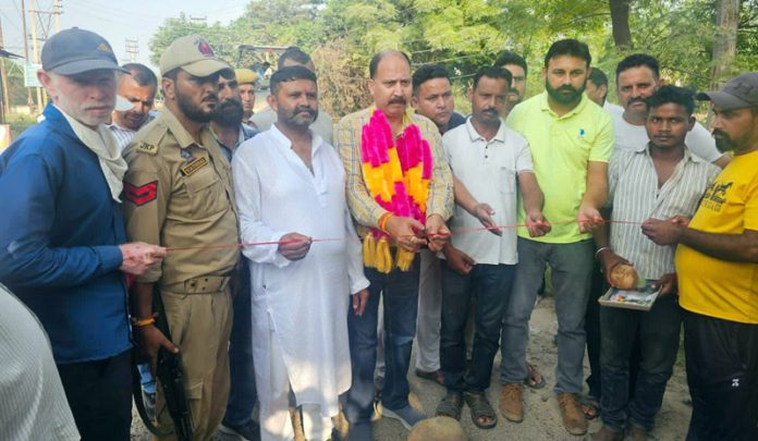 MLA Dr Rajeev Bhagat inaugurating macadamization work of a road in Bishnah.