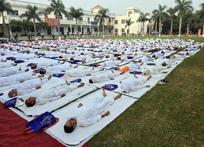 The Yog Sadhaks performing Yoga Asans at BYS Headquarters at Gole Gujral Jammu on Thursday.